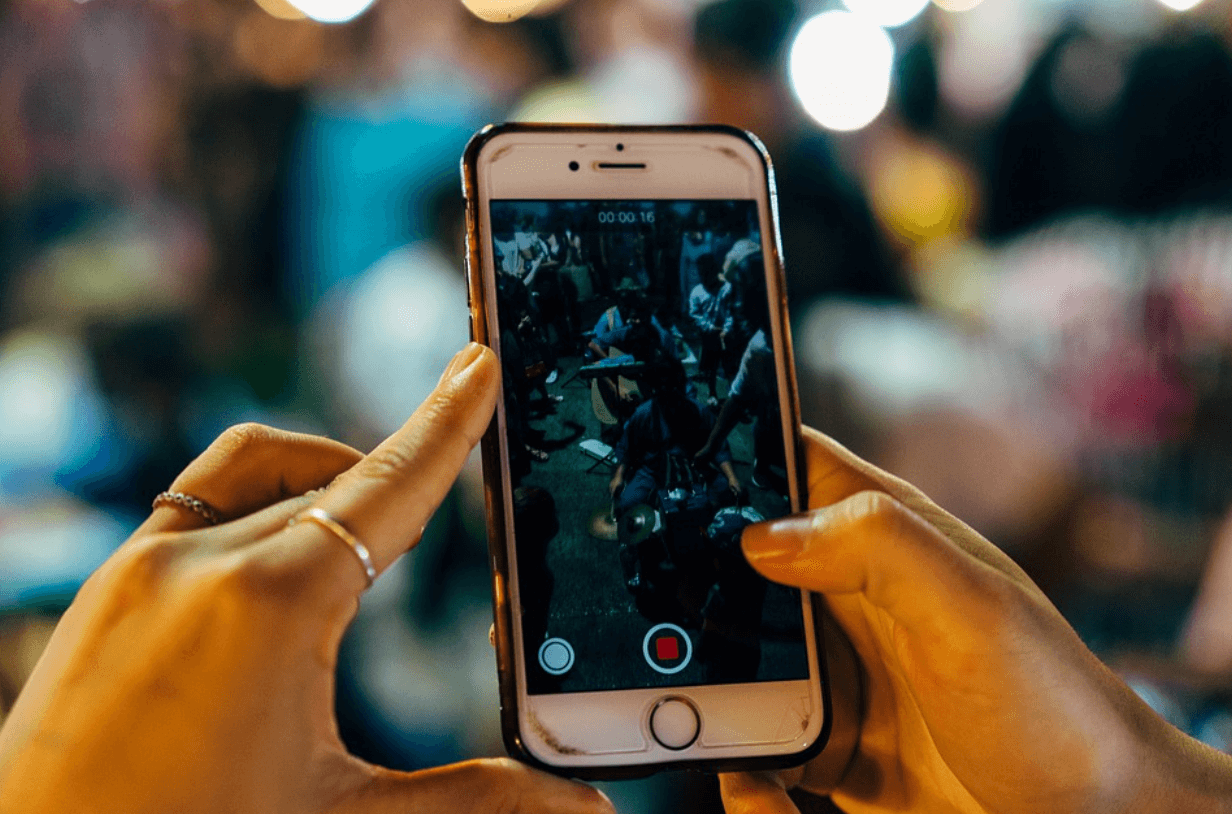 How to Properly Use TikTok: A Step-by-Step Guide 1 a person sitting at a desk with a laptop and cell phone